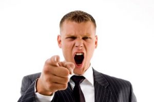 portrait of shouting businessman on an isolated background