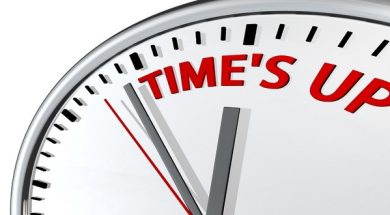 Time is up concept clock closeup isolated on white
